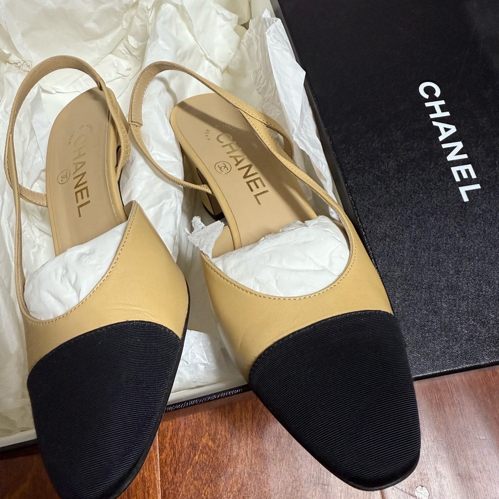 CHANEL Tan and Black Flats with Iconic Two-Tone Design